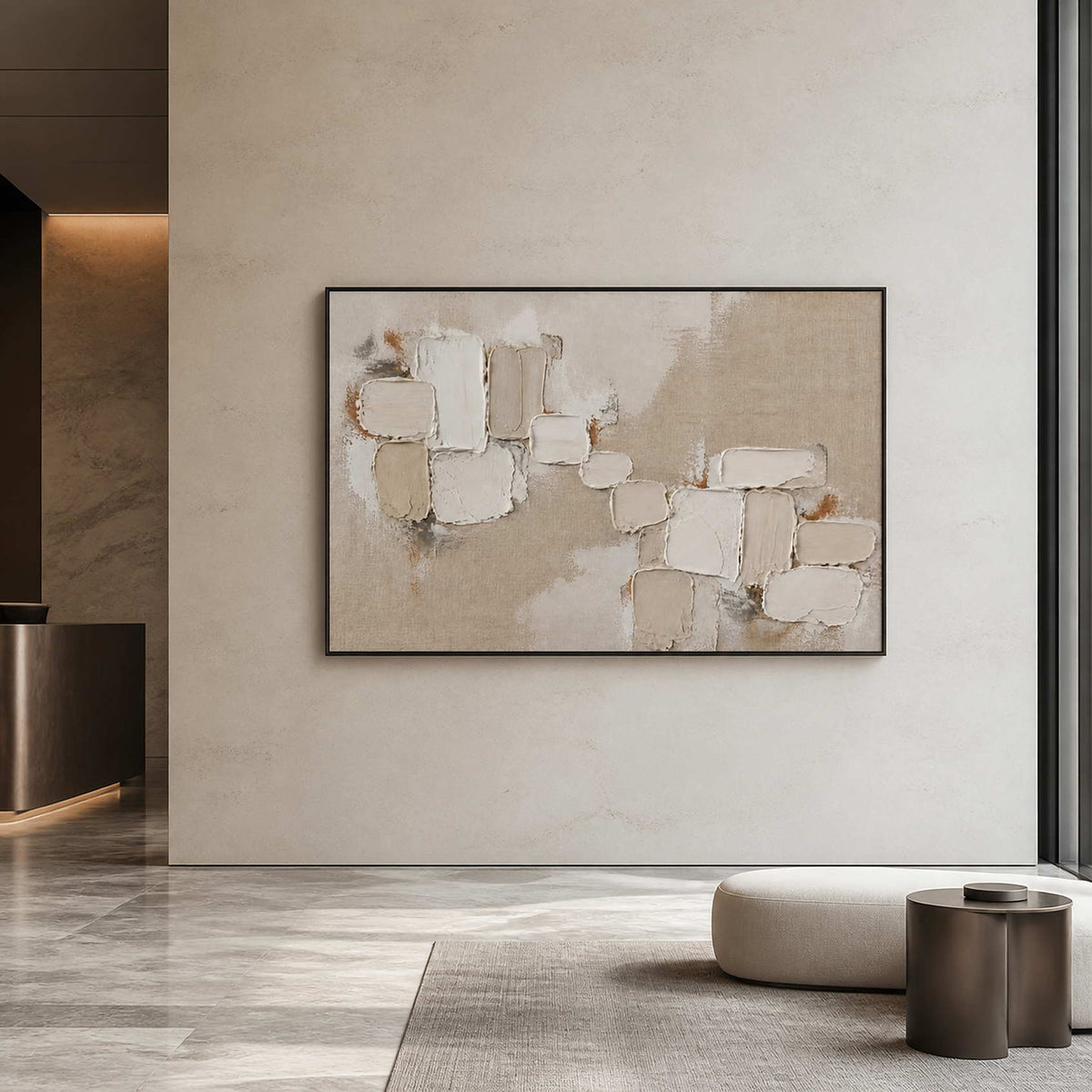 Large neutral textured abstract wall art displayed in an upscale hotel lobby.