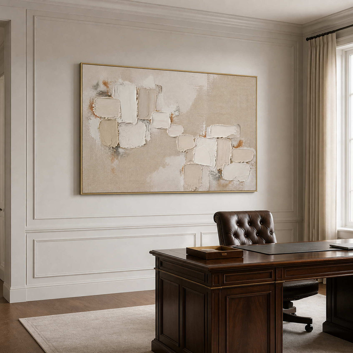 Soft neutral abstract wall art in a private office with a gold frame.