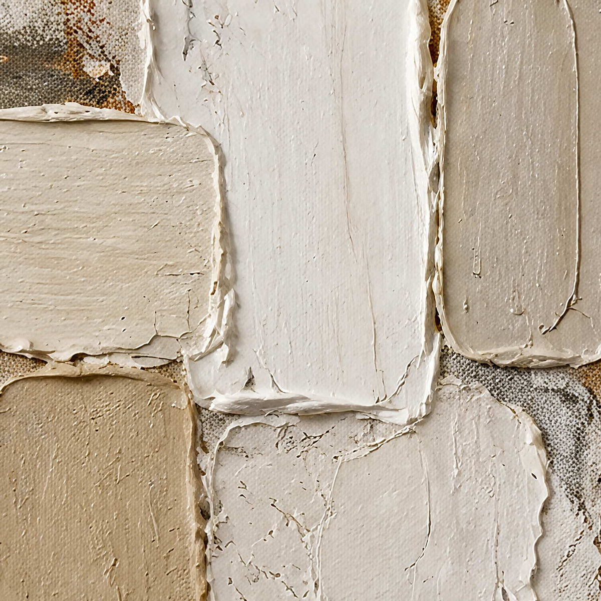 Close-up of raised ivory, cream, and taupe hand-painted block texture.