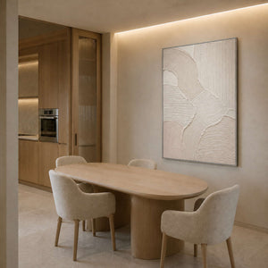 Neutral relief canvas displayed beside a pale oak dining table.