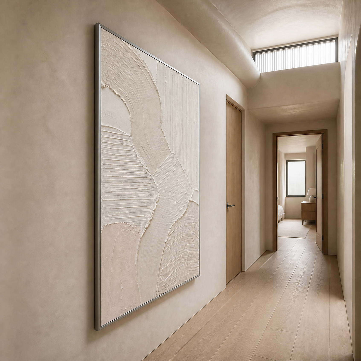 Raised neutral wall art viewed along a warm plaster hallway.