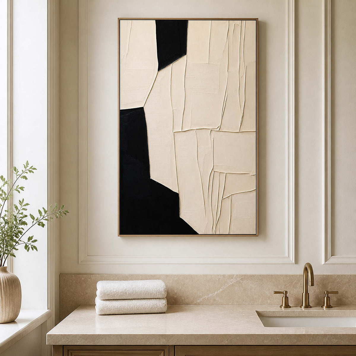 Wood framed cream abstract artwork above a stone vanity in a bathroom dry area.