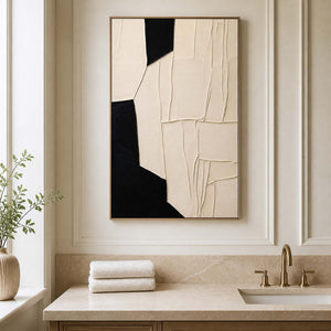 Wood framed cream abstract artwork above a stone vanity in a bathroom dry area.