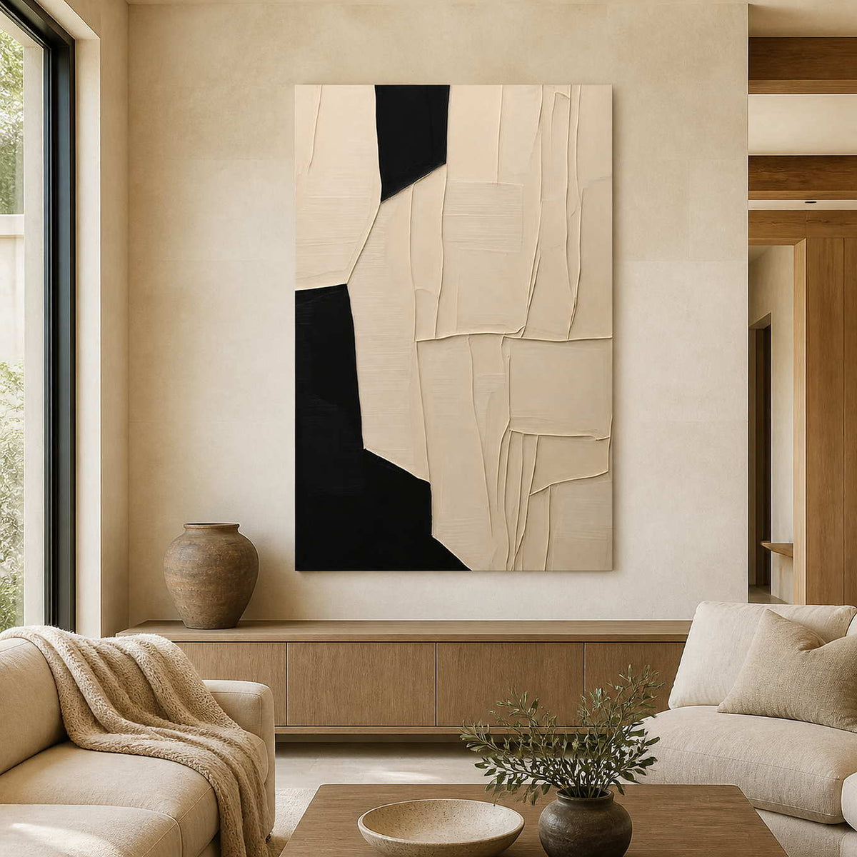 Frameless cream and black abstract artwork above wooden furniture in a neutral living room.