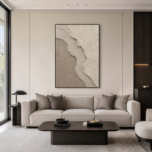 Textured neutral wabi sabi wall art in a refined living room with a black frame.