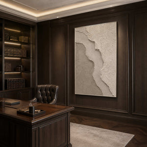 Textured minimalist wall art displayed in a sophisticated office with a silver frame.