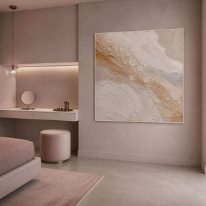Quiet gold orbits across ivory wall art in a contemporary bedroom.