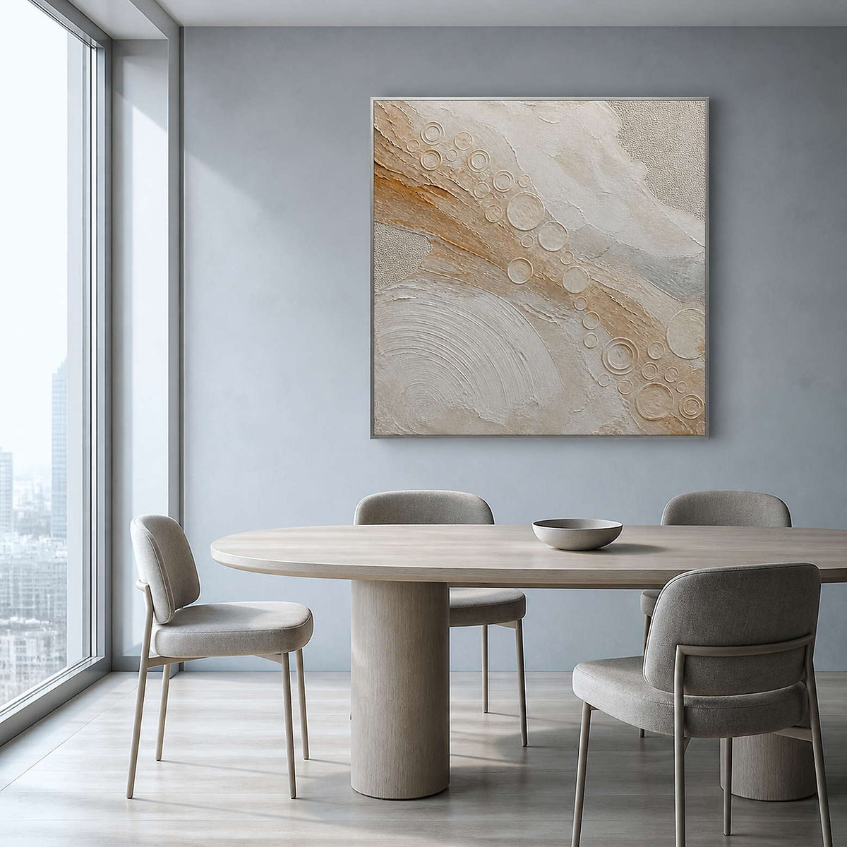 Quiet gold orbits across ivory wall art in a contemporary dining room.