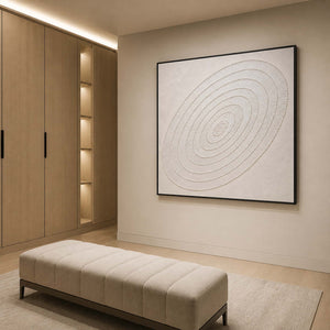 Textured concentric white wall art displayed in a serene luxury bathroom.