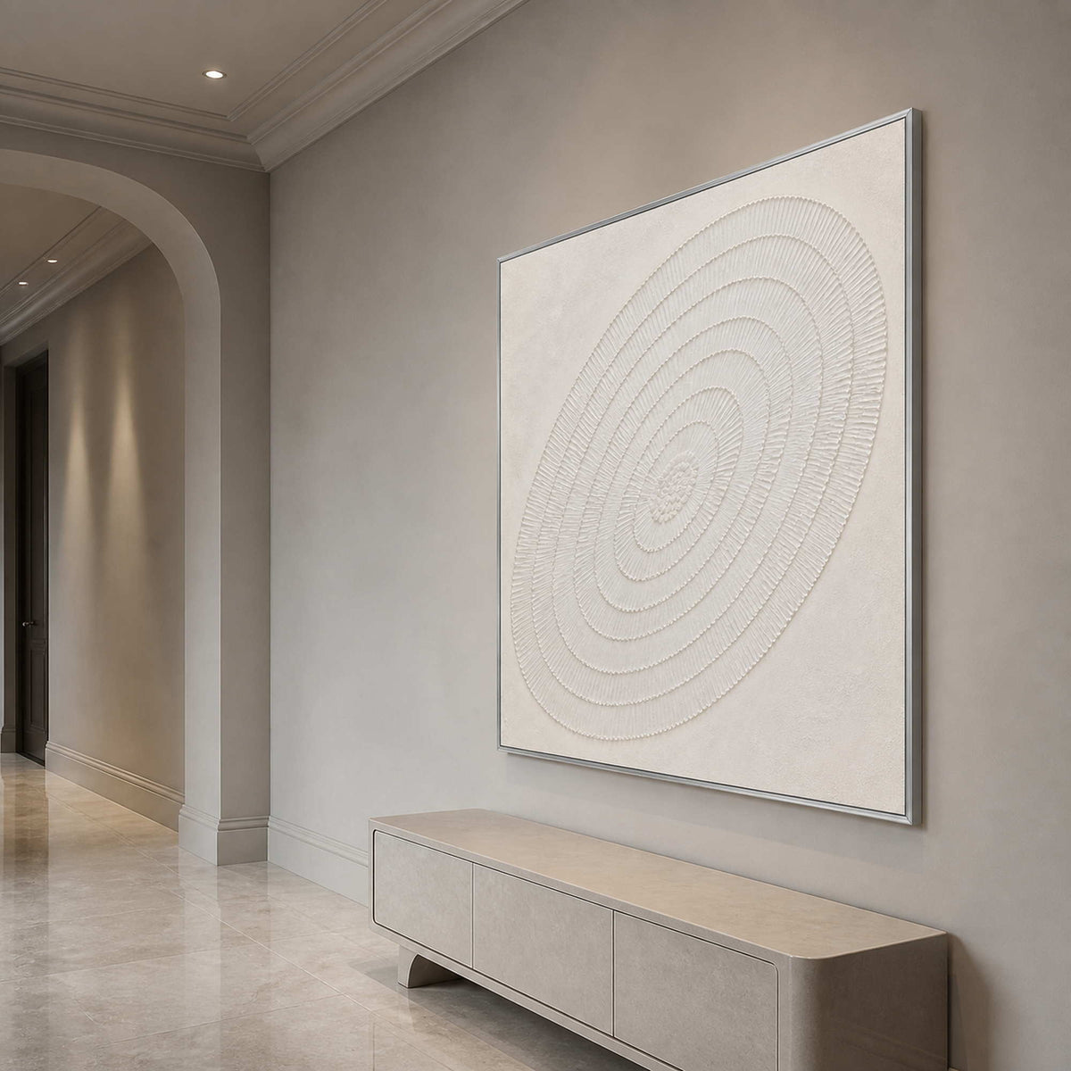 Sculptural concentric abstract wall art displayed in an elegant luxury entryway.
