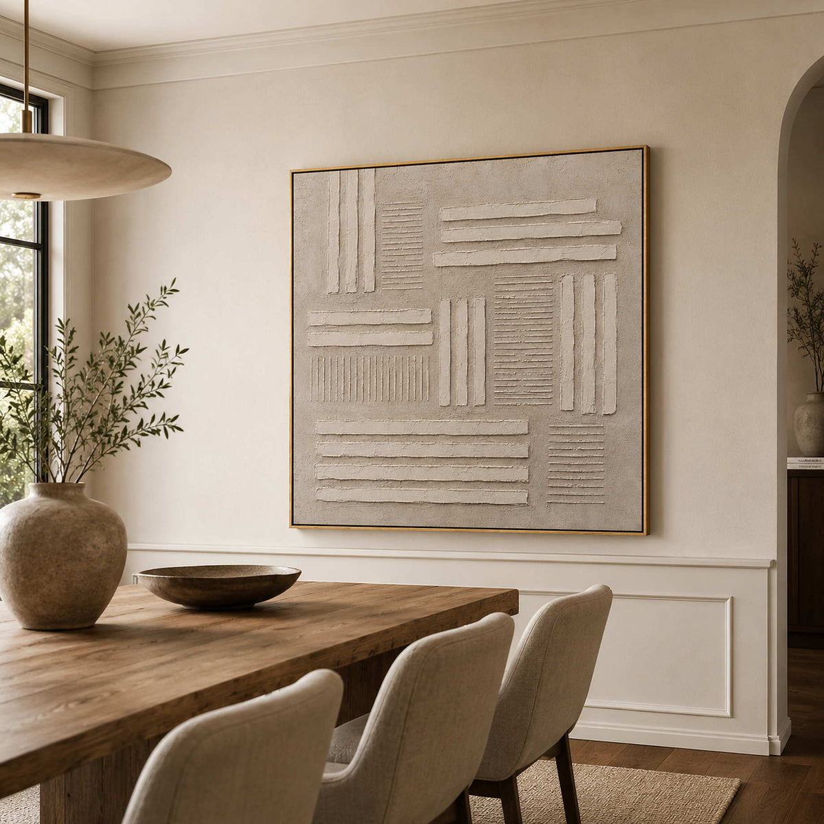 Neutral relief canvas in a refined dining room.