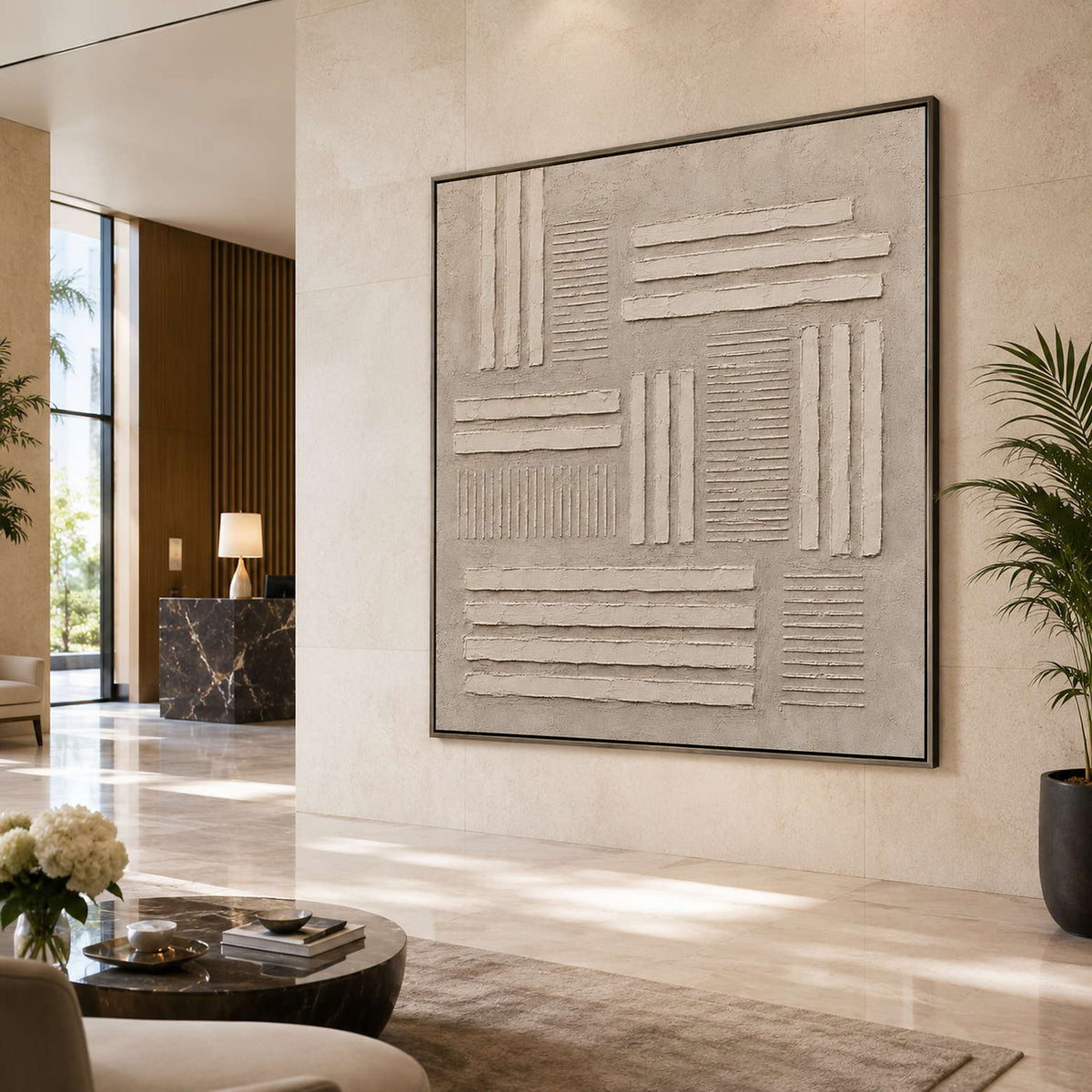 Neutral textured wall art displayed in a hotel lobby.