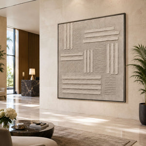 Neutral textured wall art displayed in a hotel lobby.