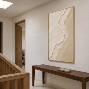 Vertical wabi-sabi textured artwork beside a walnut staircase.