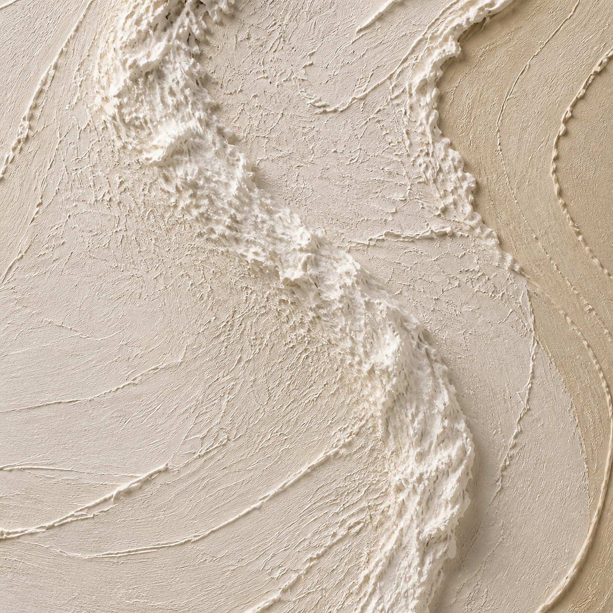 Close-up of raised ivory ridges and layered warm sand paint texture.