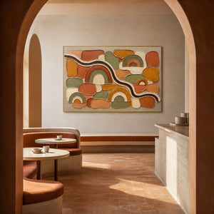 Terracotta rainbows and warm geometric blocks wall art in a contemporary hospitality lounge.
