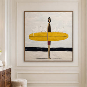 Wood framed surfer artwork near a vanity in a bright bathroom dry area.