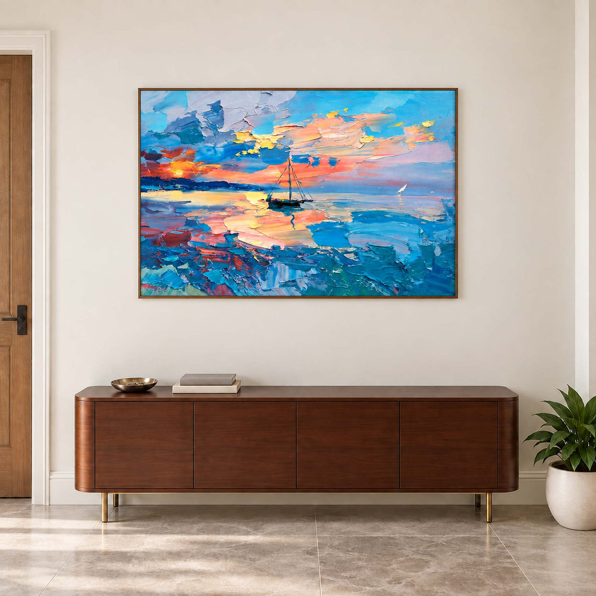 Warm-reflection sea artwork above a dark wooden cabinet.