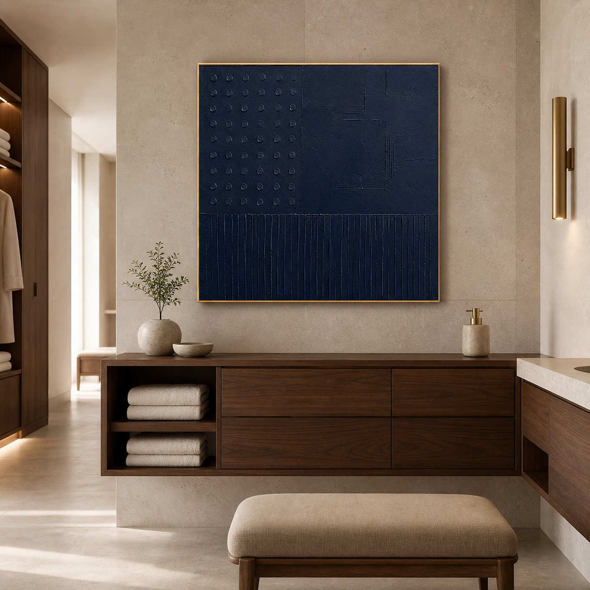 Textured navy canvas in a warm limestone hotel bathroom.