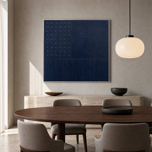 Textured navy artwork displayed in a refined walnut dining room.