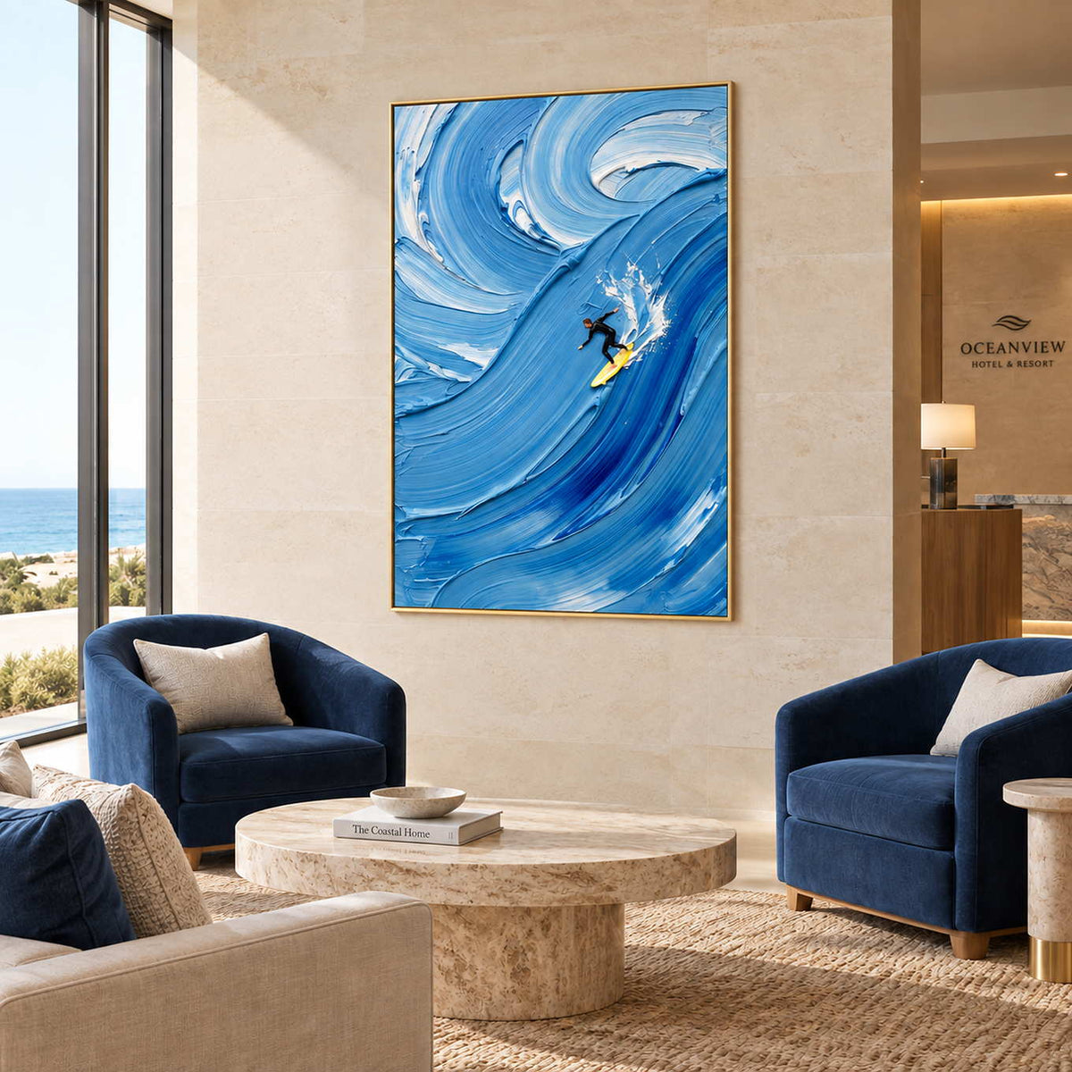 Riding the Wave in a gold frame above navy armchairs and a round stone table in a commercial lobby.