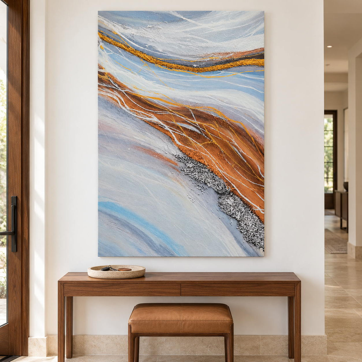 Artwork showing pale blue-gray bands curving around ochre areas with fine white lines in an entryway above a console or bench, with no outer frame.