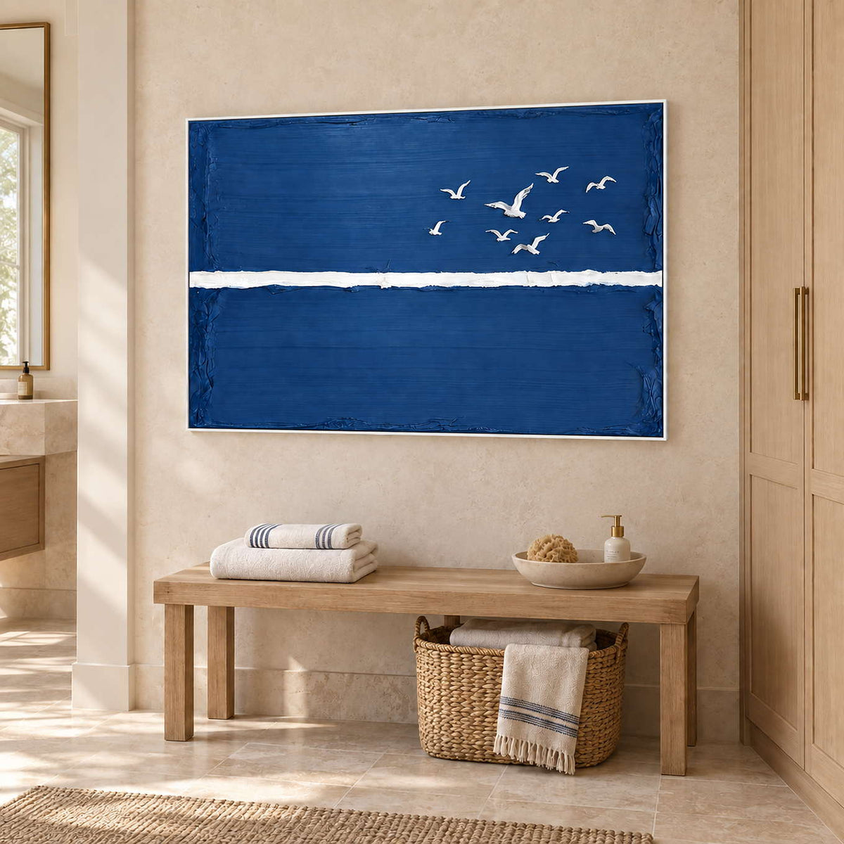 Room to Fly in a white frame above a wood bench with folded towels and a woven basket beside a bathroom vanity.