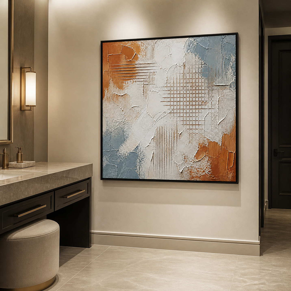 Textured modern wall art in a refined bathroom with a black frame.