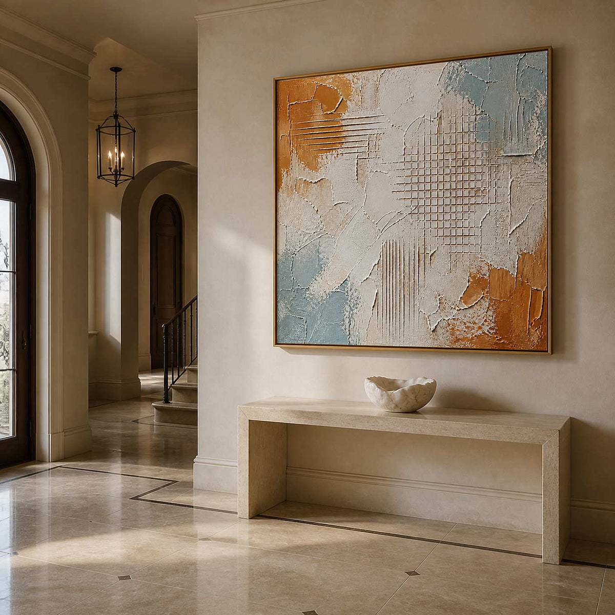 Architectural textured wall art in an elegant entryway with a wood frame.