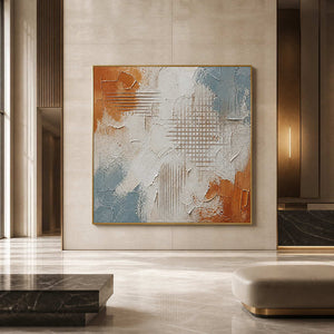 Large rust and blue abstract wall art in a modern hotel lobby.