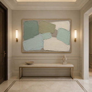 Muted green abstract wall art displayed above a minimalist entryway console.