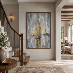 Gilded coastal canvas displayed beside a warm residential entryway staircase.