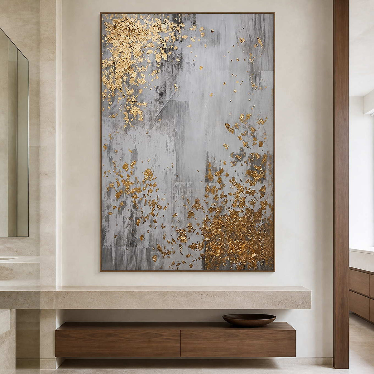 Wood framed gray and gold abstract artwork beside a stone bathroom vanity.