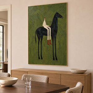Horse-and-rider artwork above a wooden sideboard near a dining table.