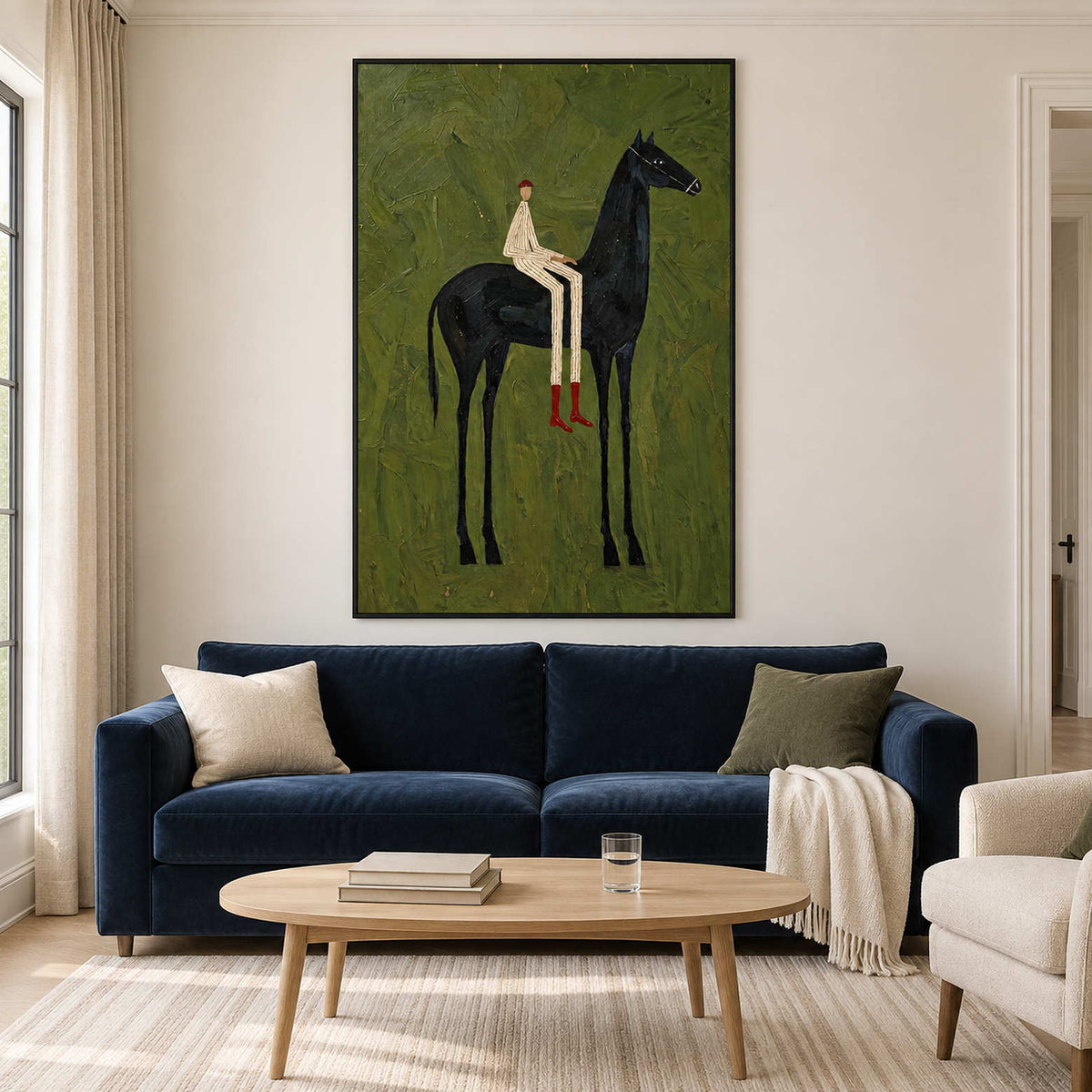 Vertical green rider painting above a dark blue sofa.