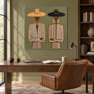 Shared Understanding in a silver frame above a dark wood desk and brown leather chair against an olive wall.