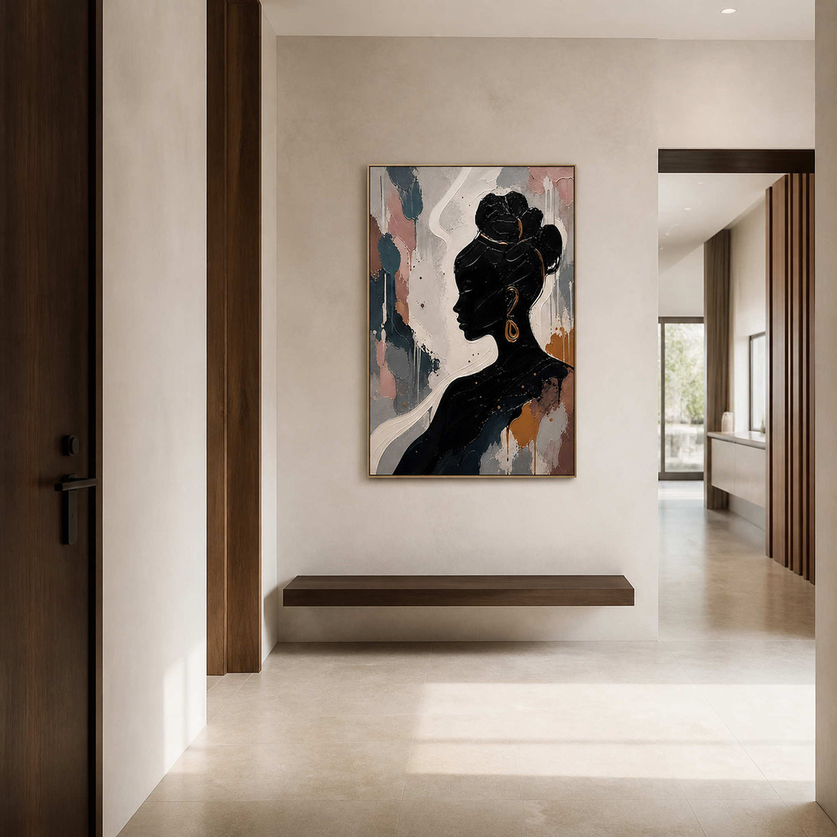Black silhouette artwork displayed in a warm ivory entry hall.