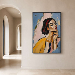 Colorful portrait wall art anchors a softly lit architectural hallway.