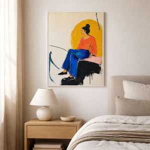 Coral and cobalt portrait wall art displayed in a warm white bedroom.