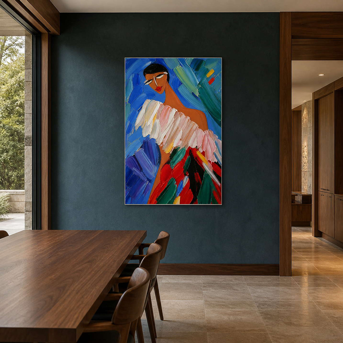 Modern portrait artwork displayed on a blue-green dining room wall.