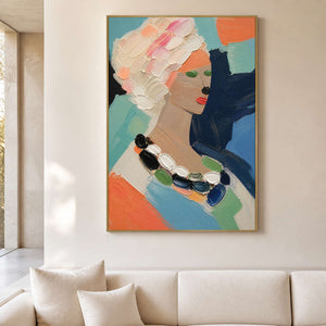 Colorful textured portrait wall art in a bright modern living room.