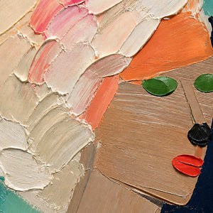 Close-up of raised ivory hair, green eyes, and coral accents.