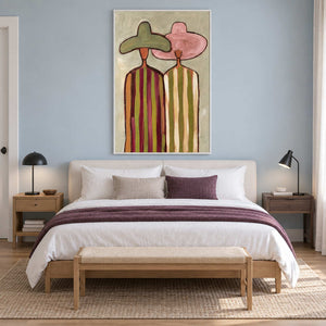 Pink-and-green hat painting on a blue bedroom wall.
