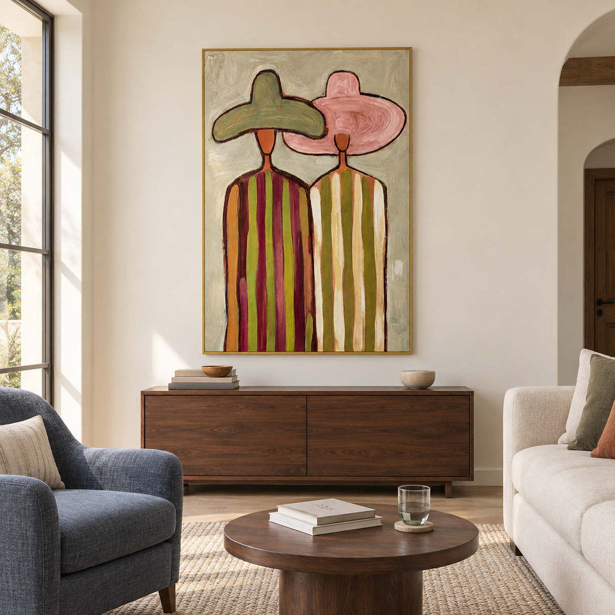 Two-figure portrait above a wooden cabinet between blue and cream seating.