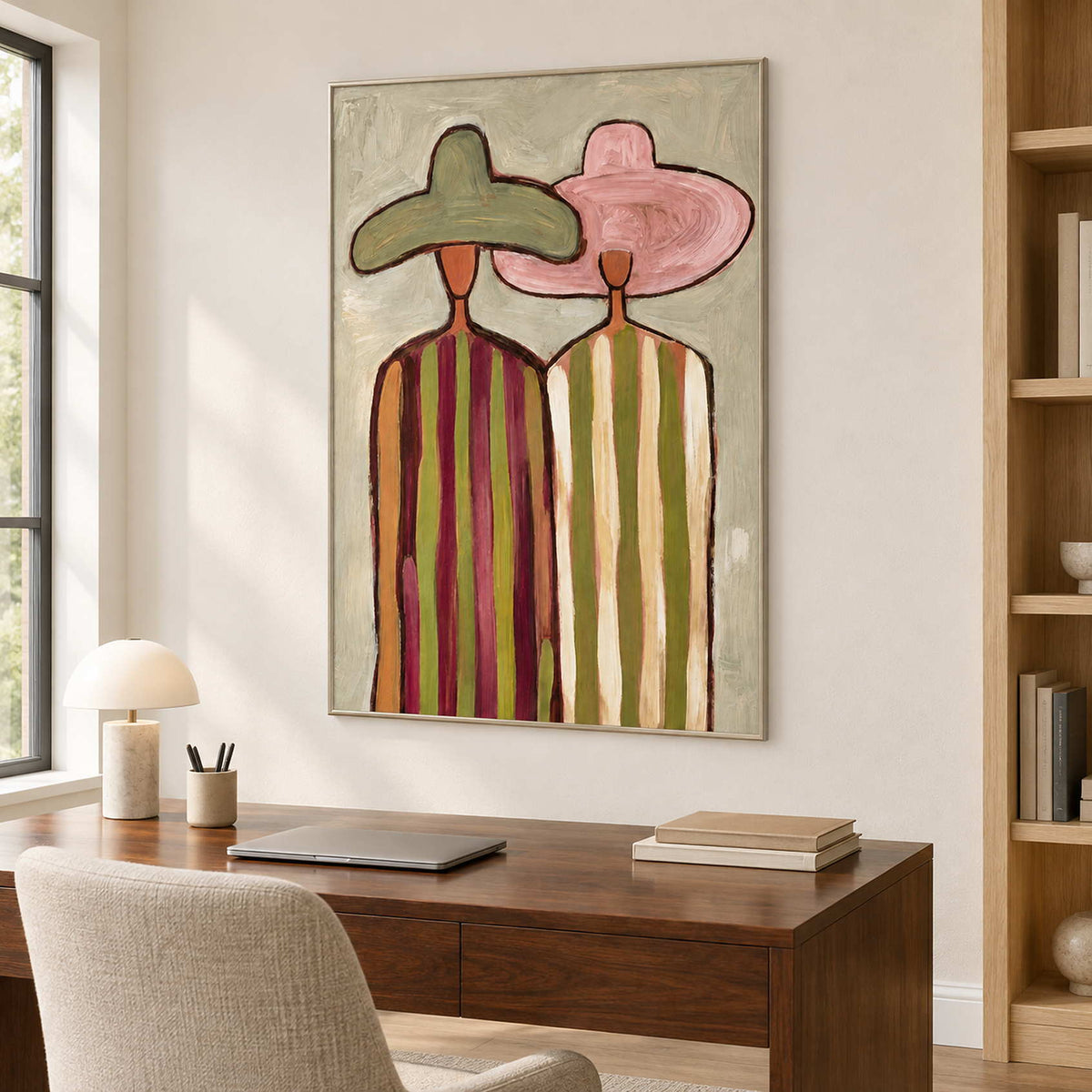 Companion portrait over a desk beside tall wooden shelving.