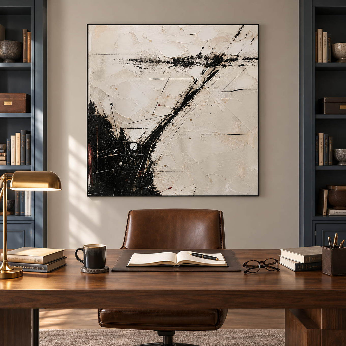 Ivory abstract painting with sweeping black marks and fine crossing lines in a black frame in a home office.