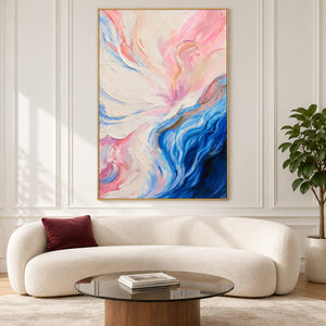 Cream and pink folds flowing into deep blue curves at the lower right in an artwork with a gold-colored frame, displayed in a living room above seating.