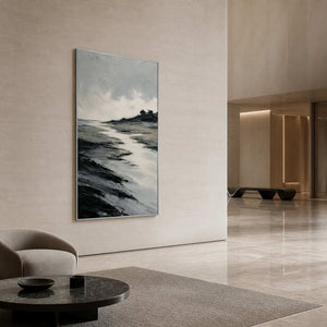 Large black and silver coastal wall art in a hotel lobby.