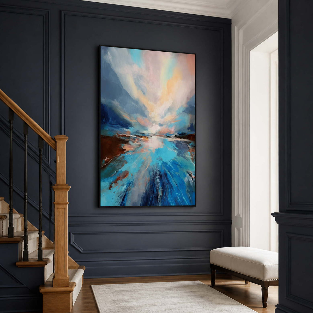 Black framed blue landscape beside wooden stairs against deep blue paneled walls.