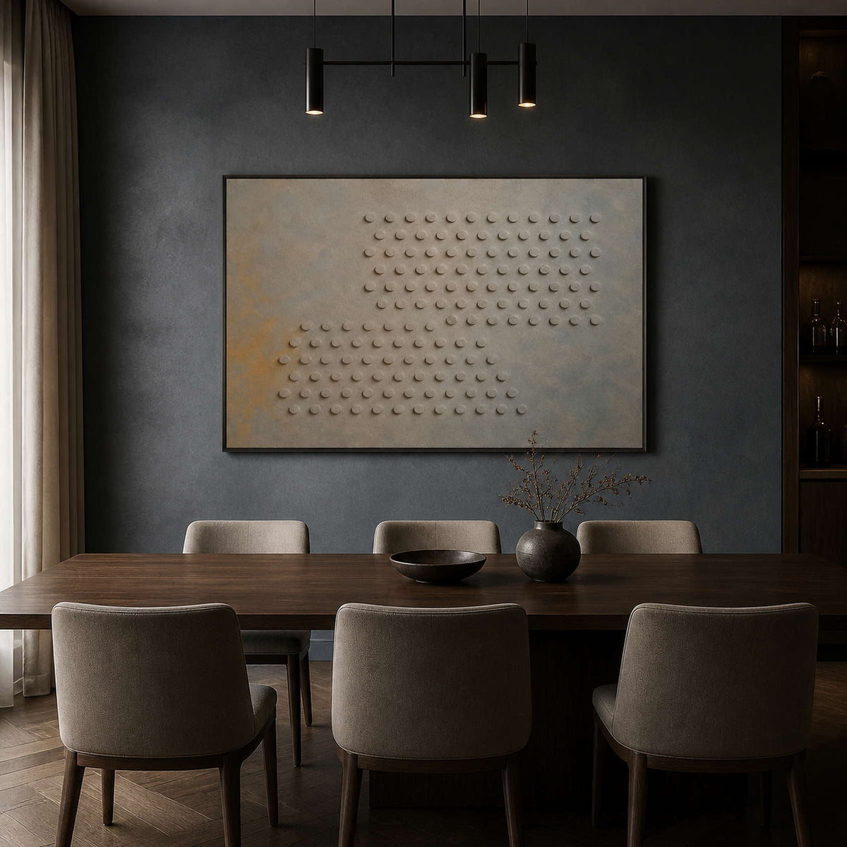 Relief circle artwork displayed in a deep blue-gray dining room.